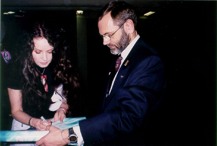 Sarah signs the poster